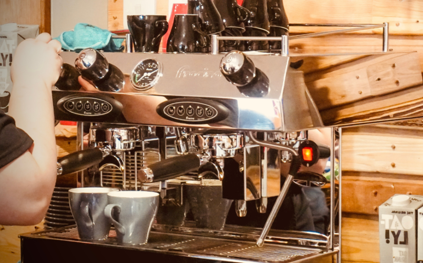 Barista making coffee on the espresso machine