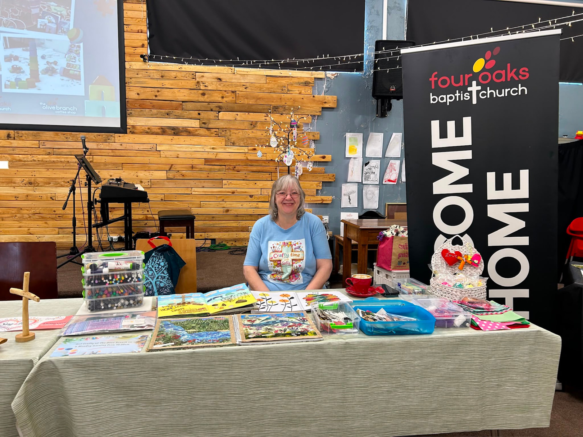 Volunteer running a craft table at church