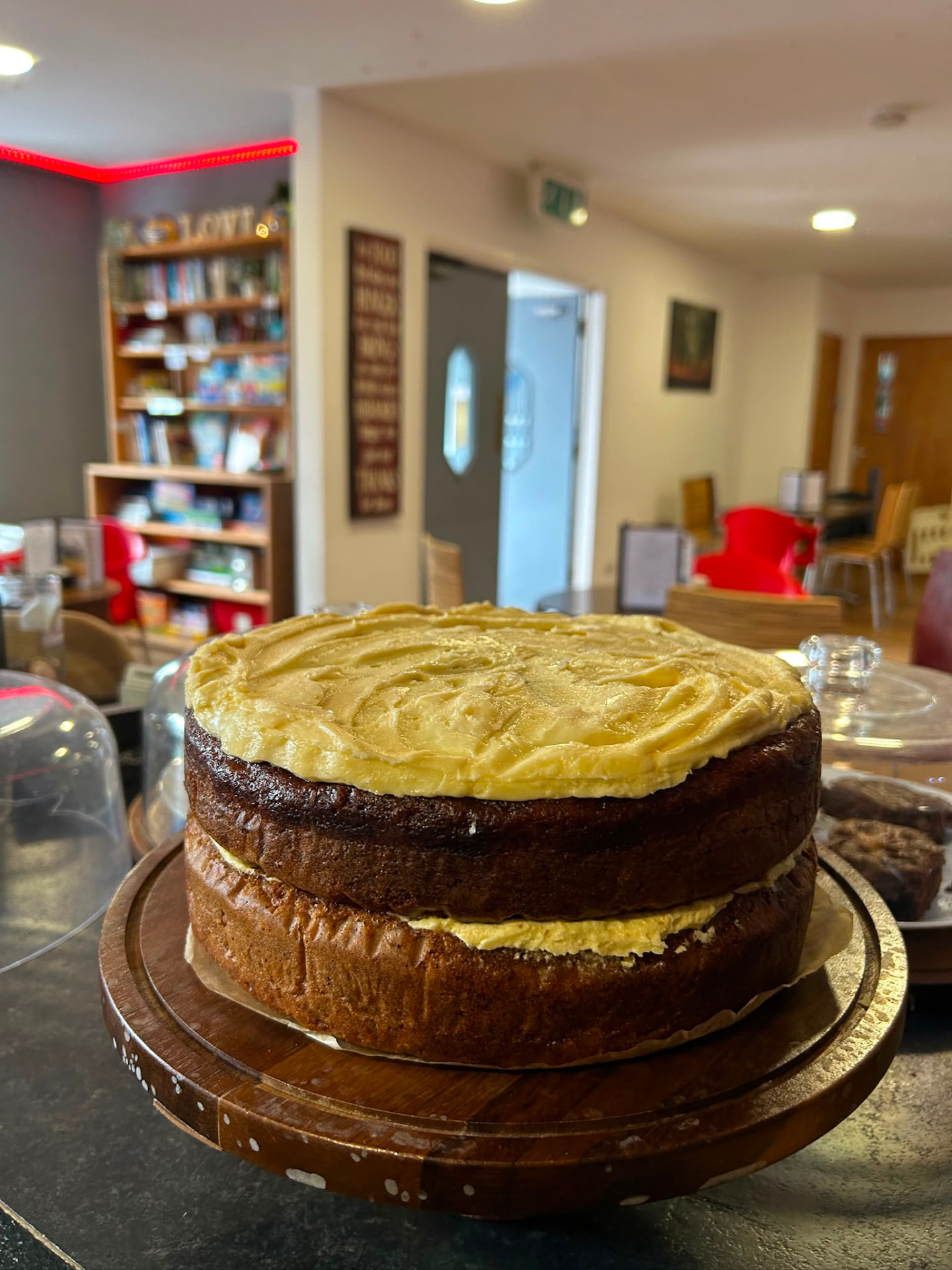 A homemade layer cake on the coffee shop counter