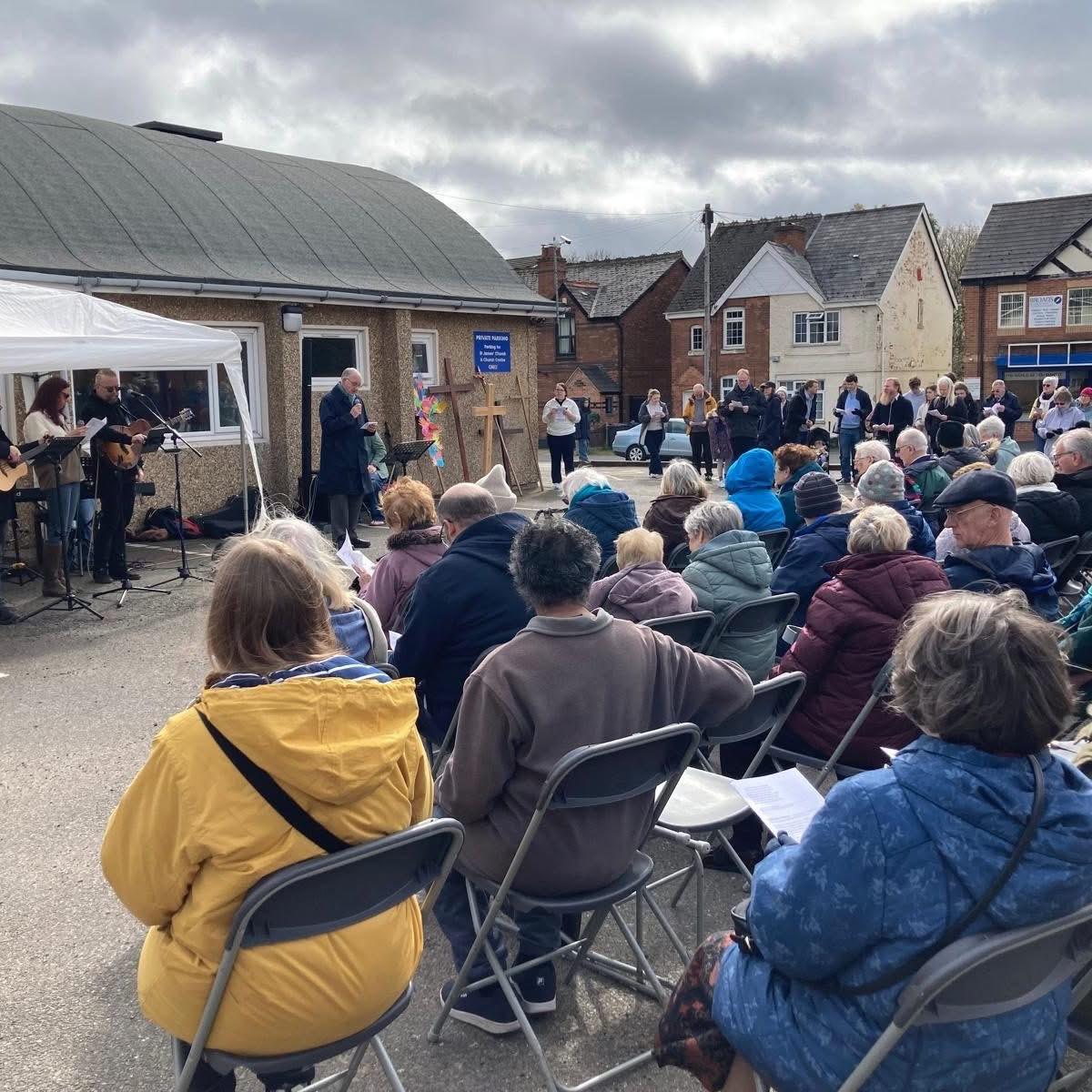Outdoor Good Friday service in Mere Green with a seated congregation and live worship band